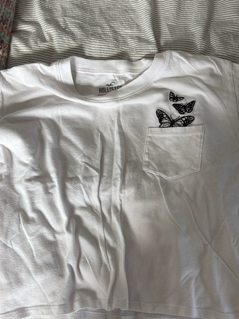 Hollister White Short Sleeve Tee with Black Butterfly Pocket Detail
